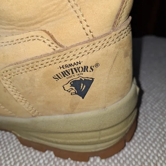 A pair of Herman Survivors leather boots in a men's size 11.5 Wide.