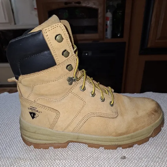 A pair of Herman Survivors leather boots in a men's size 11.5 Wide.