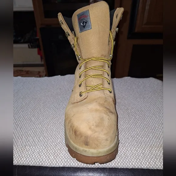 A pair of Herman Survivors leather boots in a men's size 11.5 Wide.