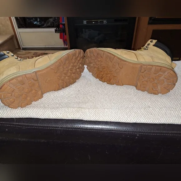 A pair of Herman Survivors leather boots in a men's size 11.5 Wide.