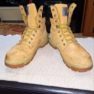 A pair of Herman Survivors leather boots in a men's size 11.5 Wide.