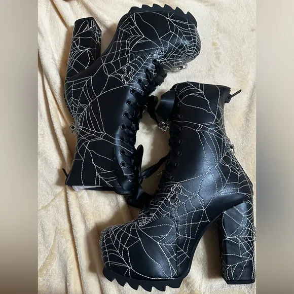 Dolls Kill Spiderweb platform heeled boots