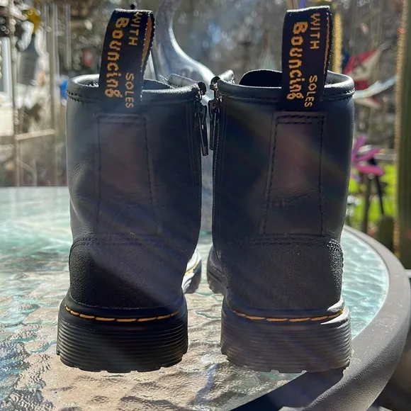 DR MARTENS High-Top Leather Boots with Lace-Up Design