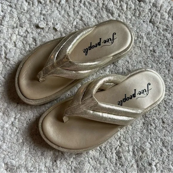 free people: Metallic Gold Leather Wonderland Flip Flop Sandals Size 37