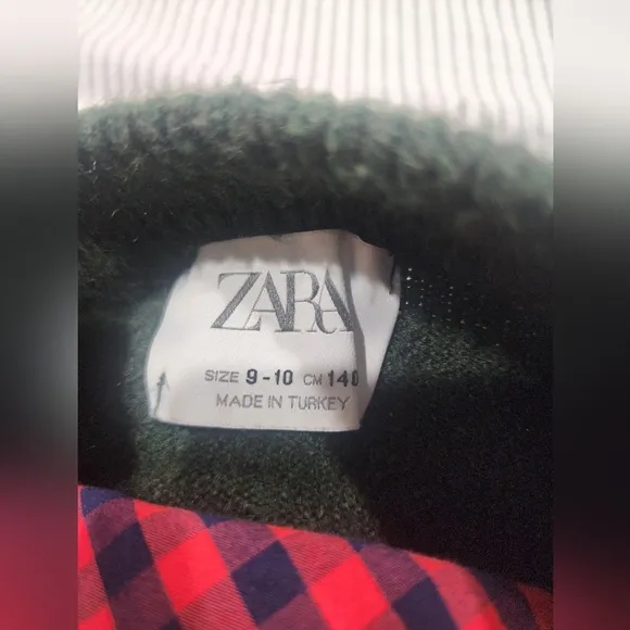 Green Sweater with Red Plaid Shirt and Tan Pants