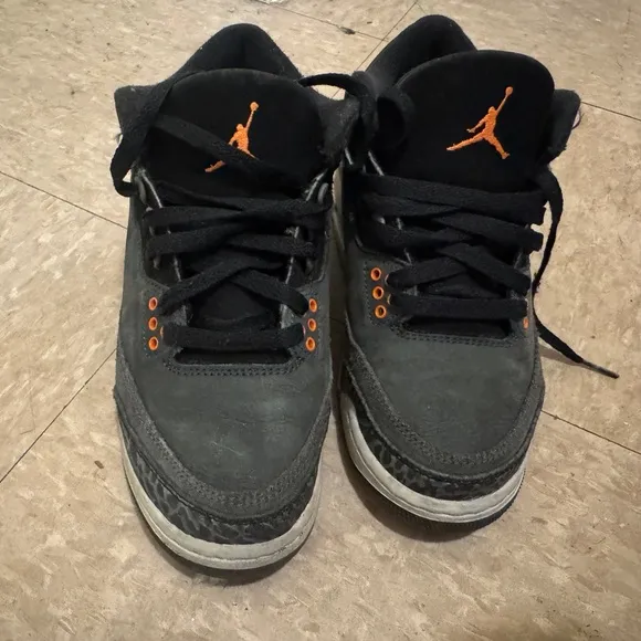 Jordan Black and Orange Sneakers with Iconic Design