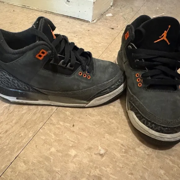 Jordan Black and Orange Sneakers with Iconic Design