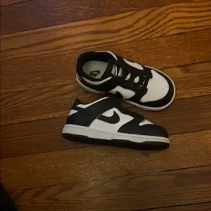 Kids Black and White Nike Shoes