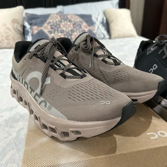 On Running Tan and Black Athletic Shoes with CloudTec