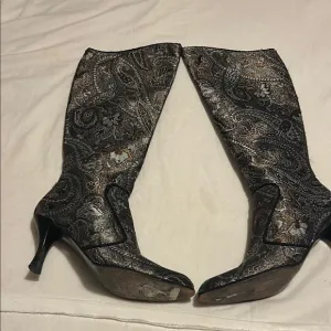 Stuart Weitzman Black and Silver Heeled Boots with Vintage Charm