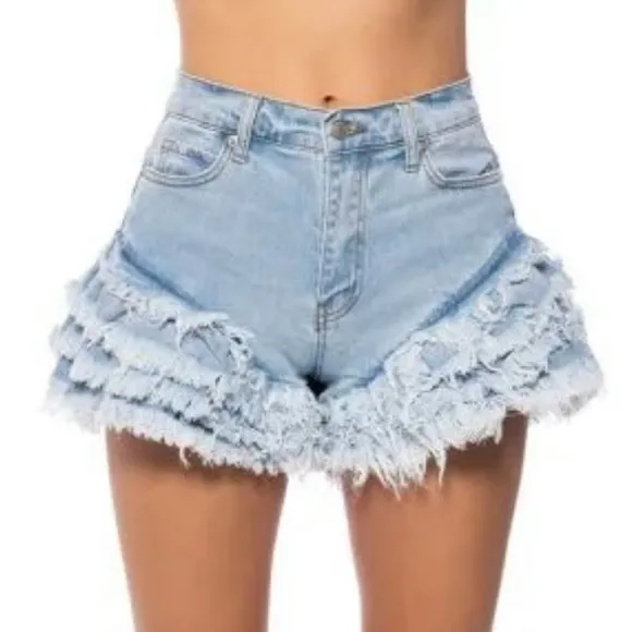 Work it Ms. thang in your booty-licious distressed ruffled denim shorts
