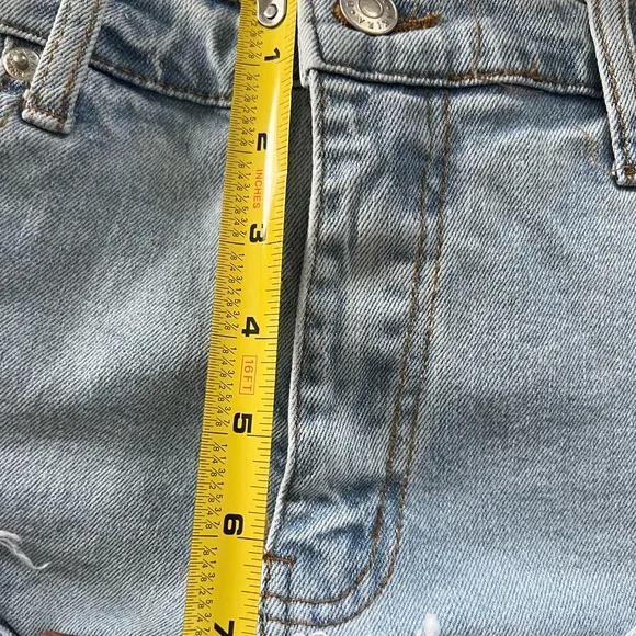 Work it Ms. thang in your booty-licious distressed ruffled denim shorts